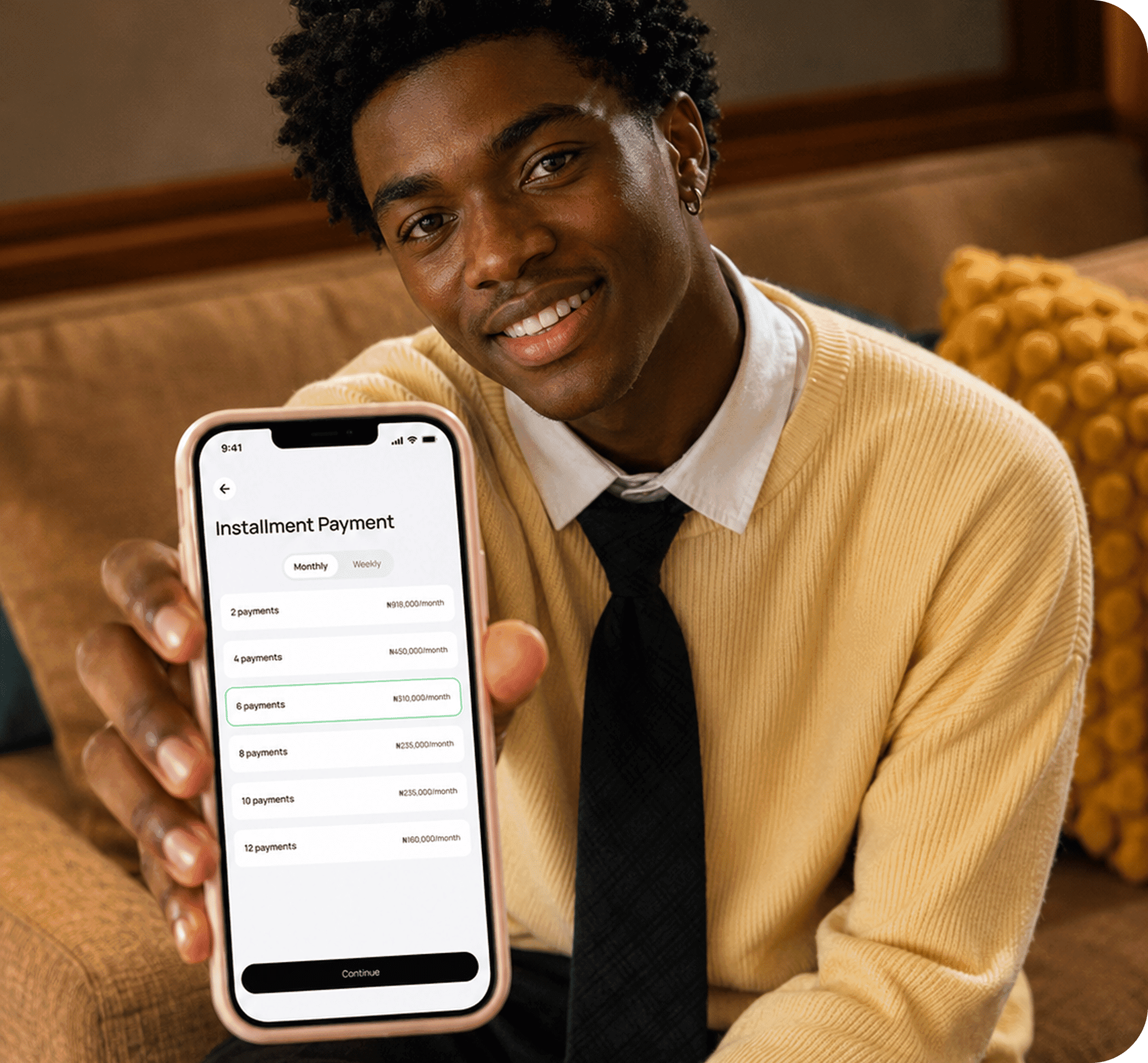 Man holding a phone showing installment payment options
