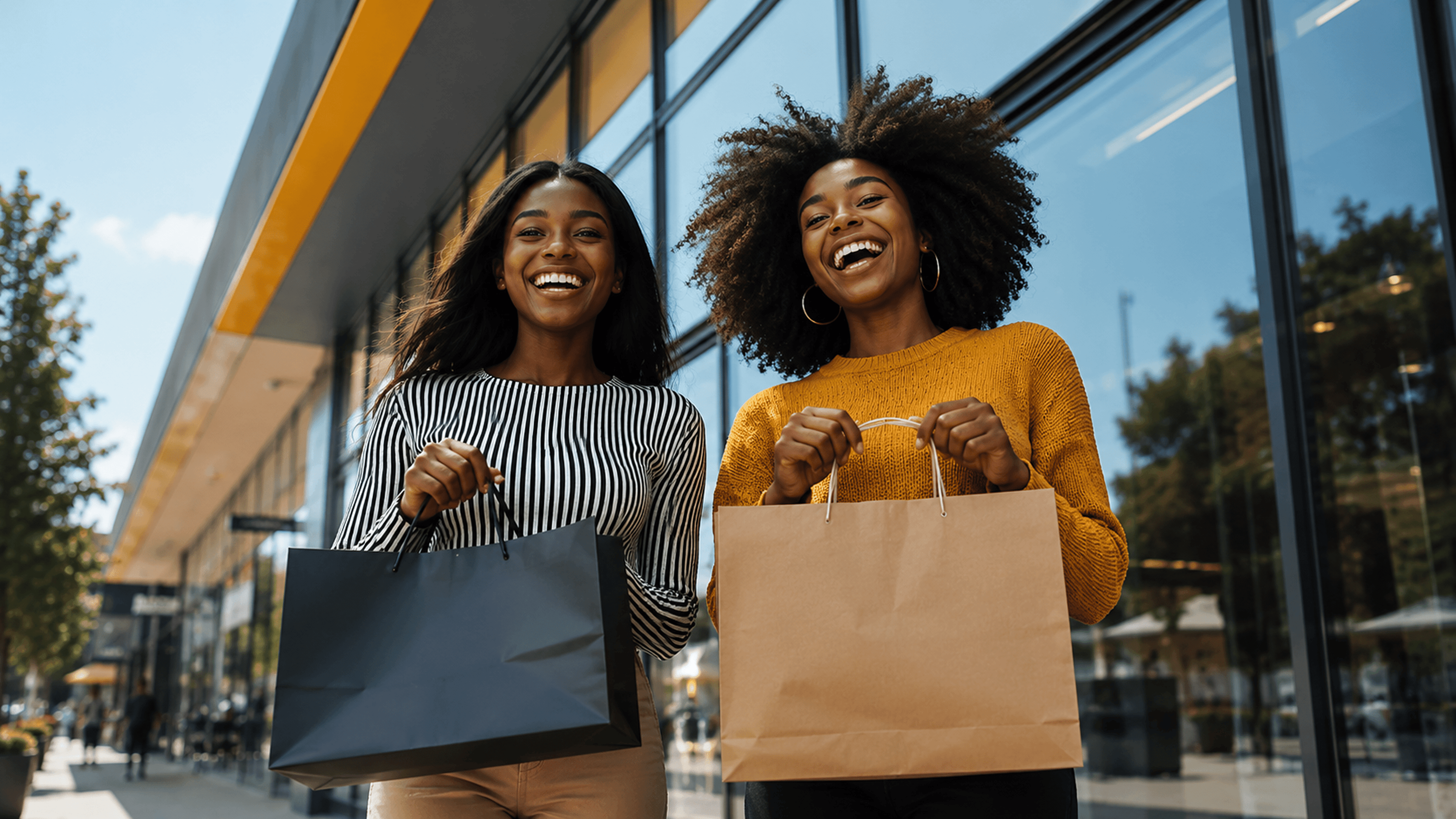 Shoppers celebrating with shopping bags